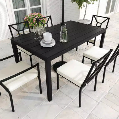 Set da pranzo da esterno Martha Stewart in acciaio da 7 pezzi con 6 sedie impilabili e tavolo da 62 pollici in nero