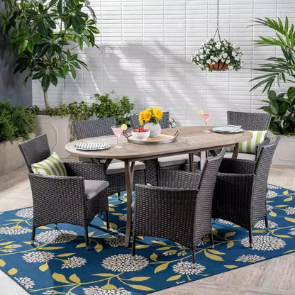 Set da pranzo a 7 pezzi Christopher Knight Home per esterno in legno di acacia e vimini con cuscini