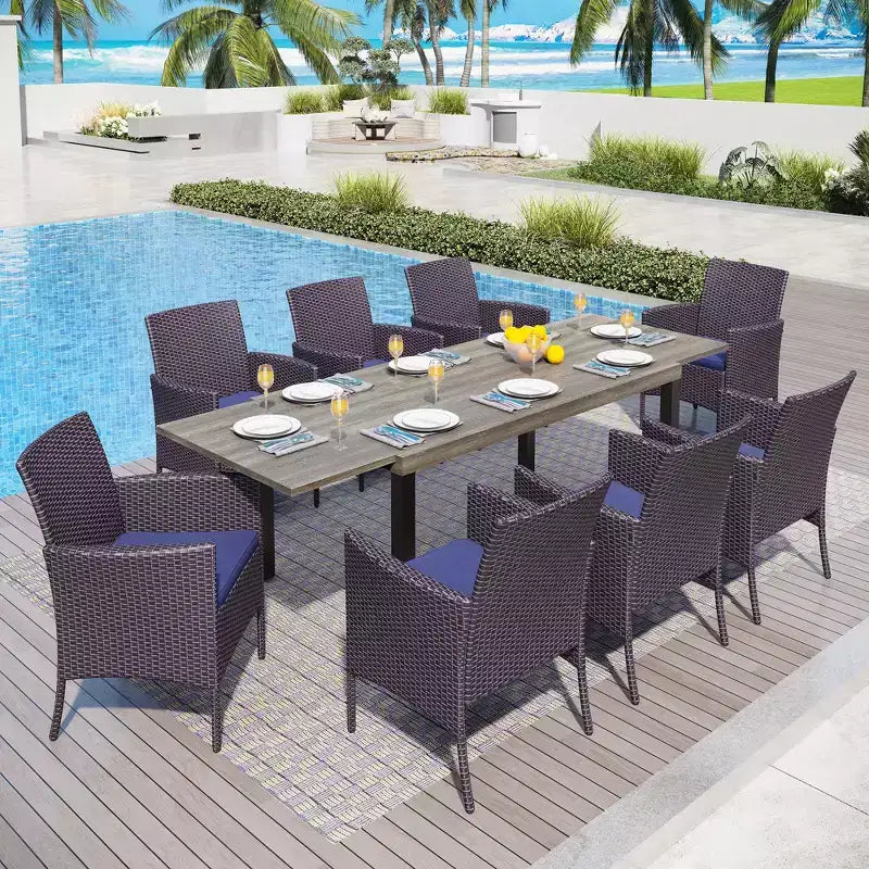 Captiva Designs Set da 9 Pezzi per Esterni con Tavolo da Pranzo Estensibile in Acciaio e Sedie a Mezzaluna in Rattan