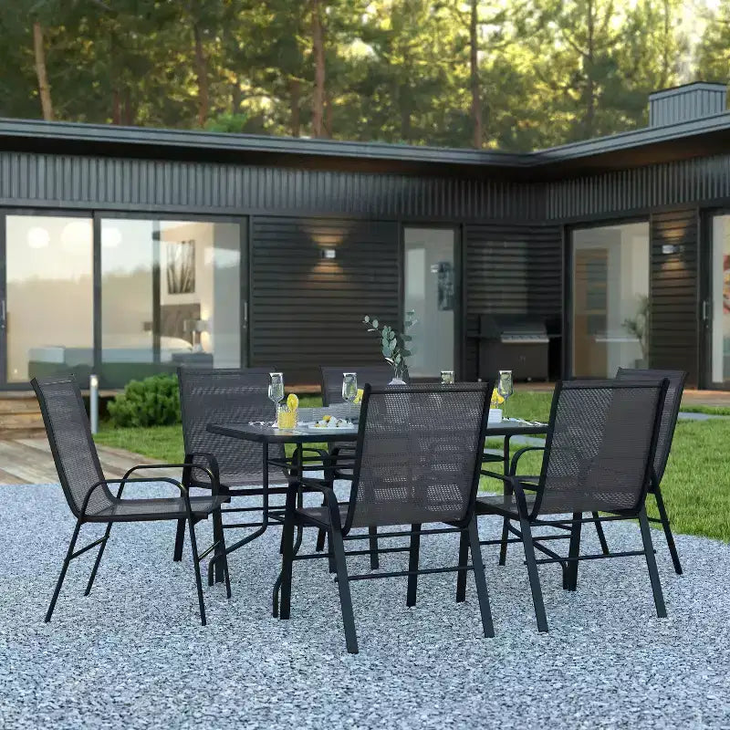Ensemble de table de patio sept pièces Emma et Oliver avec table en métal avec plateau en verre trempé et 6 chaises empilables Flex Comfort