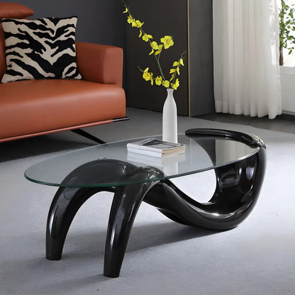 Table basse ovale moderne et abstraite avec plateau en verre et base en métal