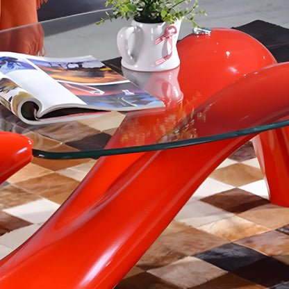 Table basse ovale moderne et abstraite avec plateau en verre et base en métal